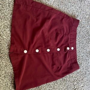 Burgundy button down skirt.